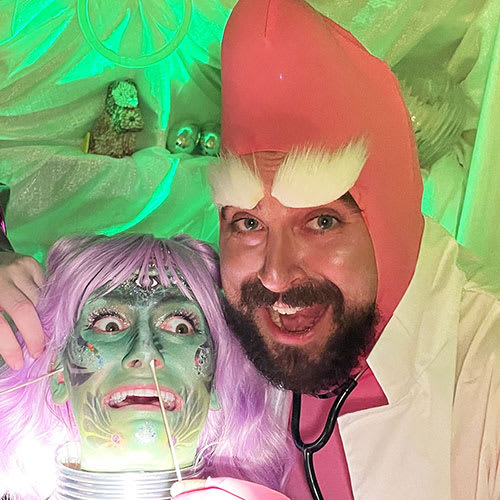 Actor, Joey Haney playing an alien doctor collecting DNA from a scared green alien