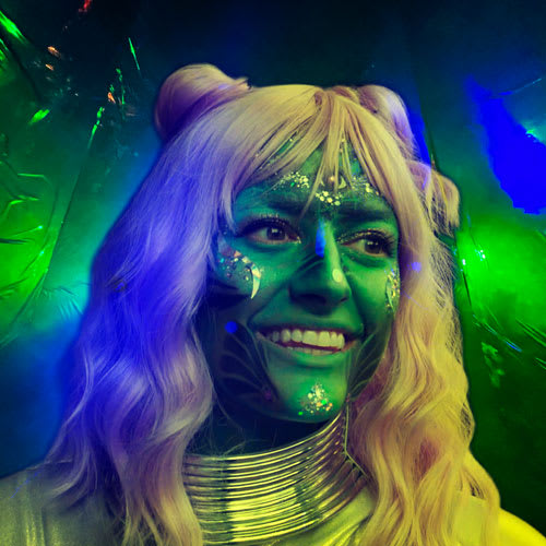 Actor, Michelle Stuessi playing a happy green alien