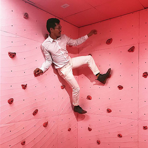 Bruce Aguirre climbing high