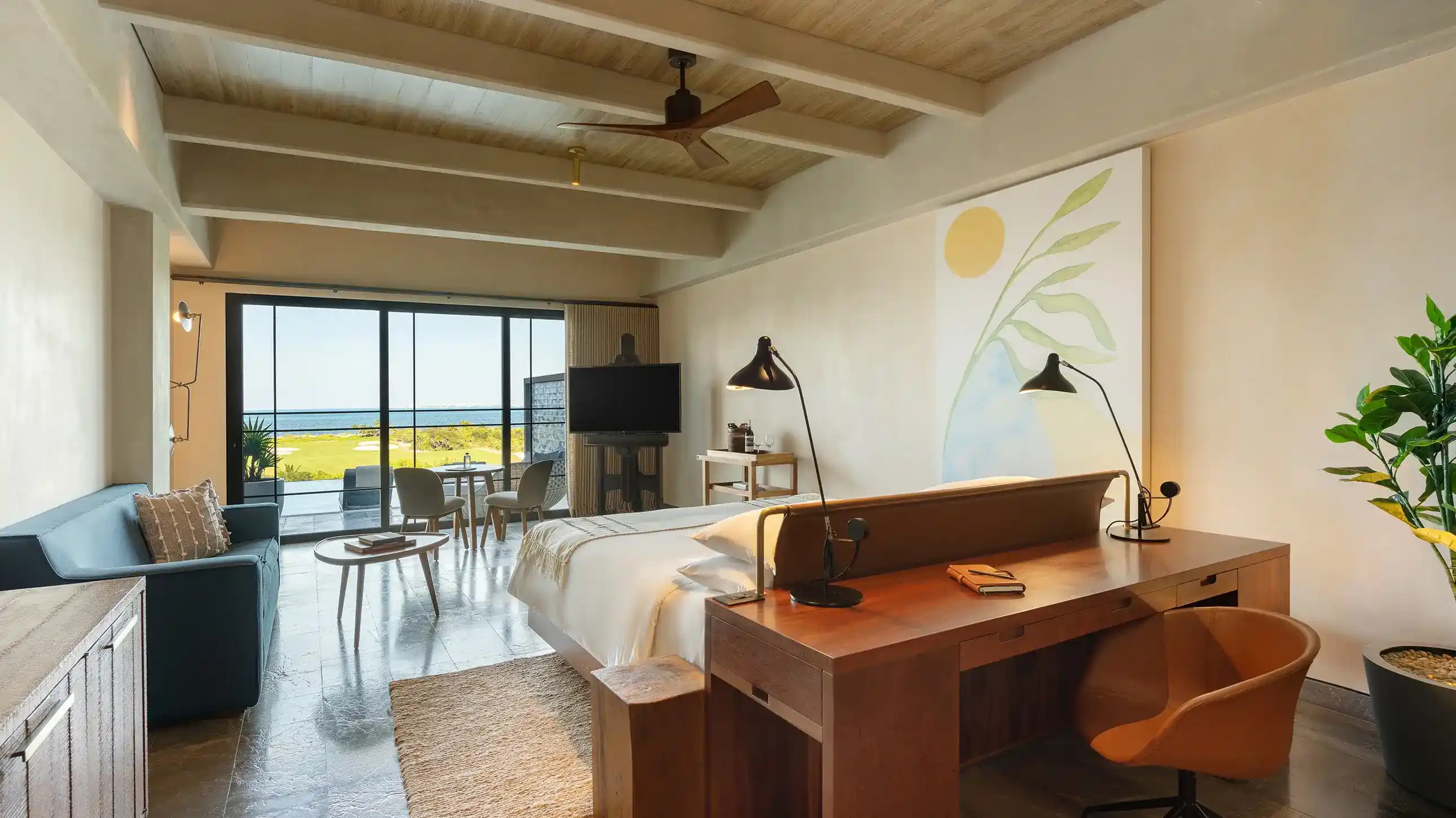 Spacious double oceanfront hotel room in Cancun with two queen beds, private balcony, floor-to-ceiling windows offering direct Caribbean Sea views, and modern minimalist design. Perfect accommodation for MICE groups, conference delegates, incentive travel participants, and corporate event attendees.