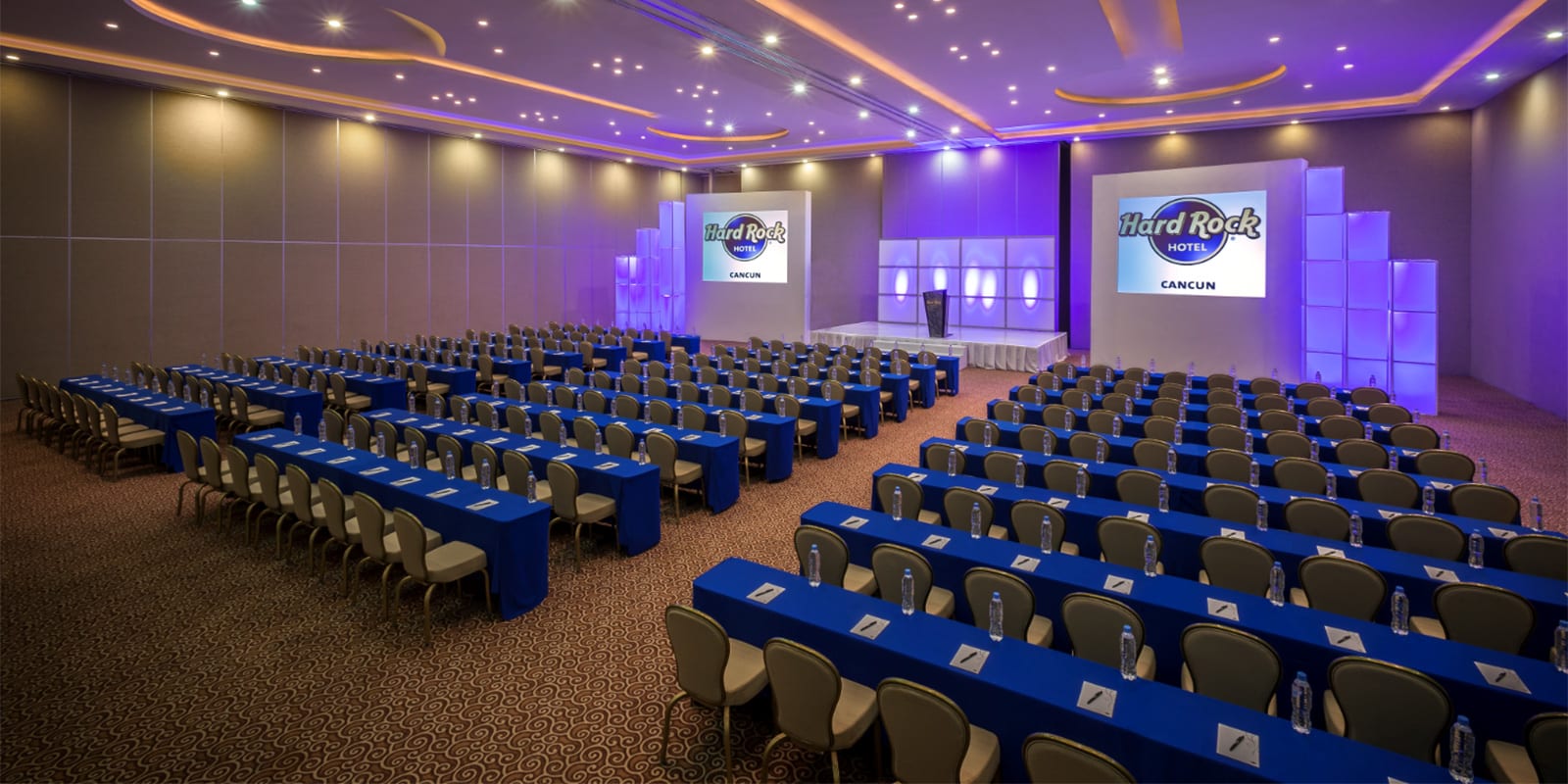 A professional meeting room setup at Hard Rock Hotel Cancun, highlighting the 16,423 square feet of total event space. Ideal for MICE industry conferences, board meetings, and gala dinners with expert audiovisual capabilities.
