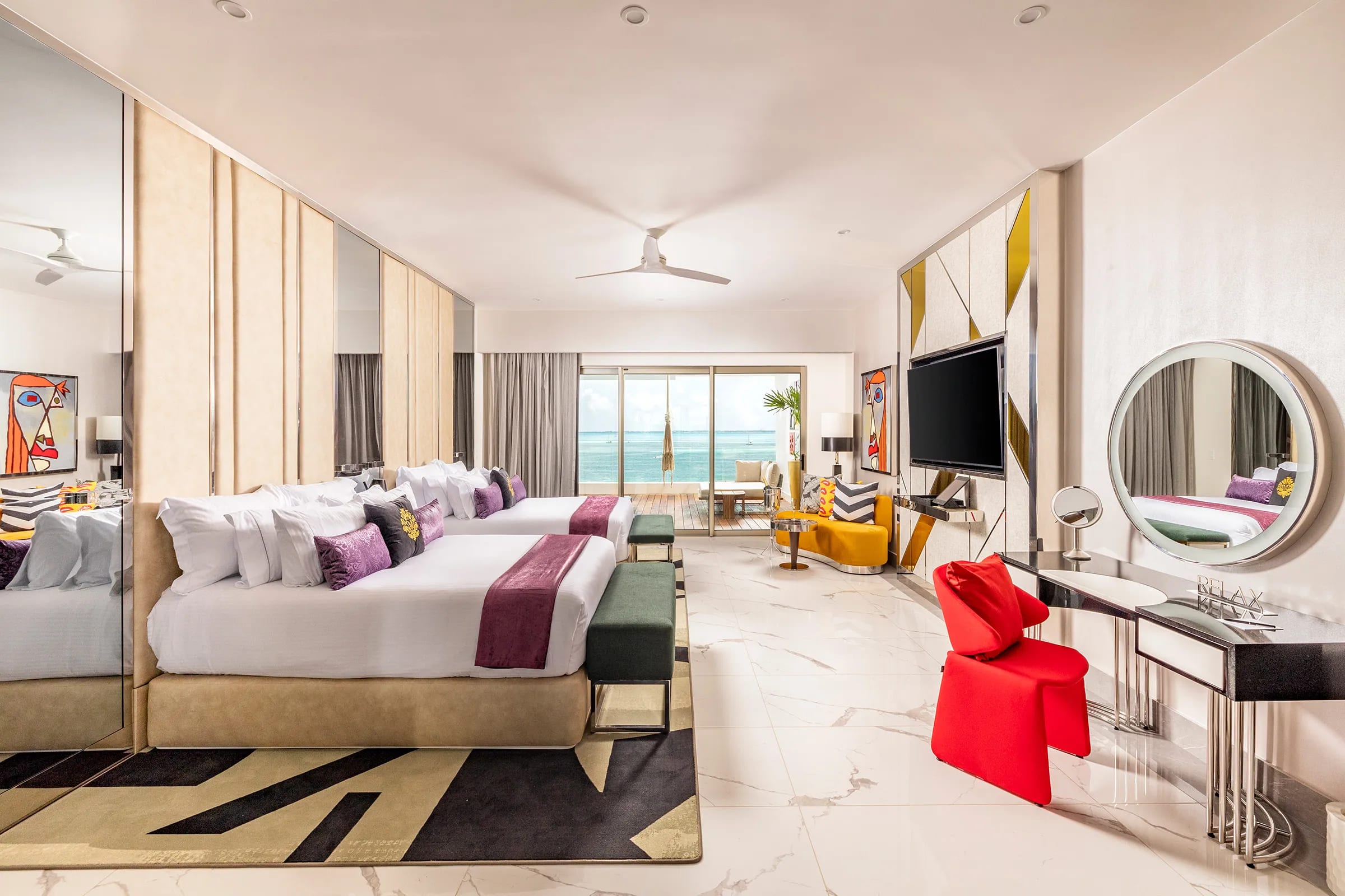 Panoramic view of the ultra-luxury Hotel Mousai Cancun, showcasing its contemporary architecture and infinity pool. A sophisticated venue for elite MICE programs, high-level executive retreats, and luxury corporate incentive travel in Costa Mujeres, Mexico