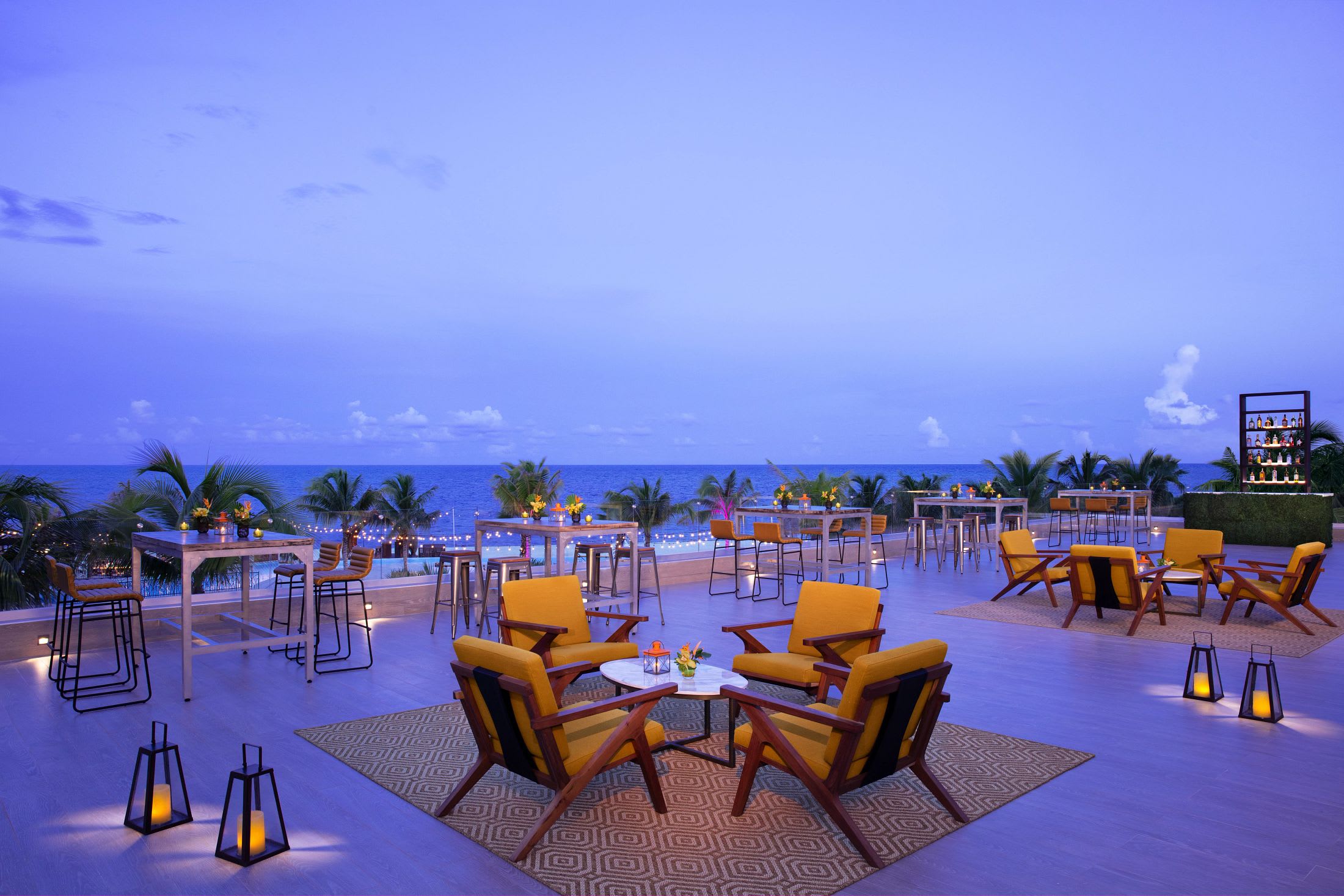 Exterior architectural view of the Hyatt Vivid Grand Island, an adults-only resort in Cancun. Showcasing modern high-rise facilities and luxury amenities perfect for MICE industry conferences, corporate leadership summits, and exclusive incentive travel rewards in Mexico.