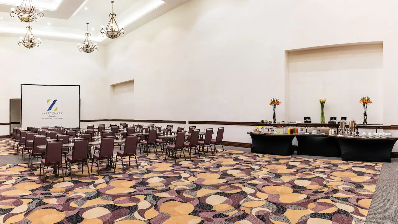 Daytime aerial view of Hyatt Zilara Cancun, an adults-only all-inclusive resort. Showcasing the expansive beachfront infinity pool and oceanfront event spaces, ideal for MICE industry networking, corporate incentive travel, and executive retreats in the Cancun Hotel Zone.