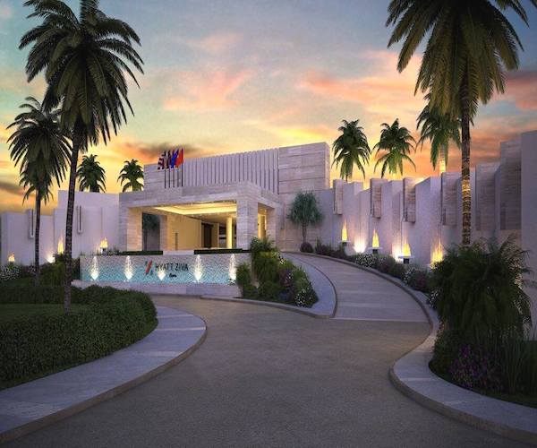 Elevated view of the Hyatt Ziva Cancun pool area and iconic lighthouse. This all-inclusive luxury resort offers unique outdoor event venues and premium amenities for MICE groups, corporate incentive travel programs, and international business summits in Cancun, Mexico.