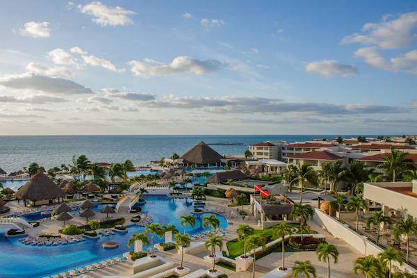 Large outdoor swimming pool at Moon Palace Cancun with expansive sun terraces and tropical landscaping, highlighting the resort's versatile outdoor spaces for poolside networking receptions, corporate incentive gatherings, and large-scale MICE events in the Mexican Caribbean.