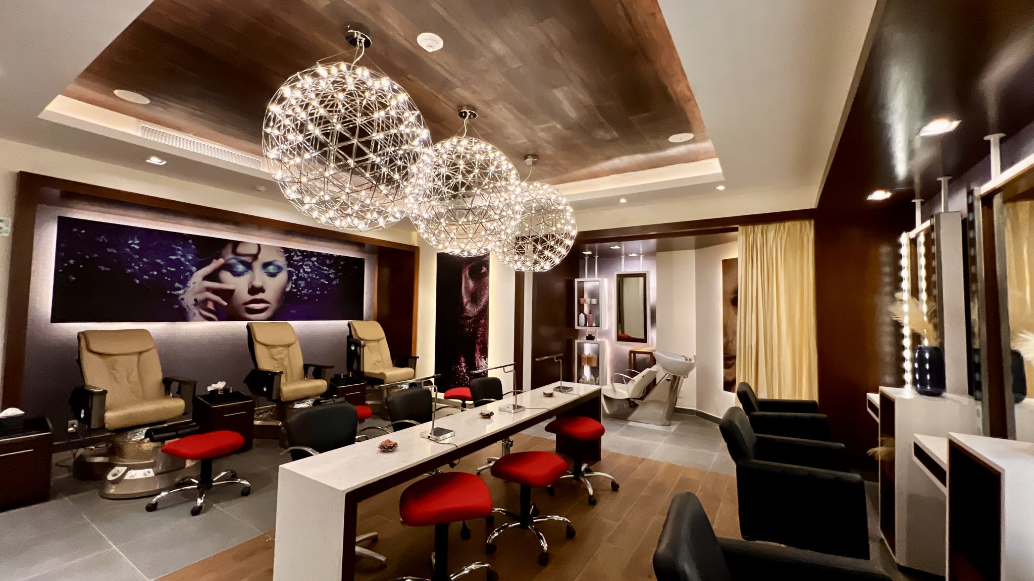 Upscale beauty salon at Royalton Chic Cancun featuring manicure, pedicure, and hair styling stations—ideal for MICE guests seeking premium wellness and grooming services during corporate events.