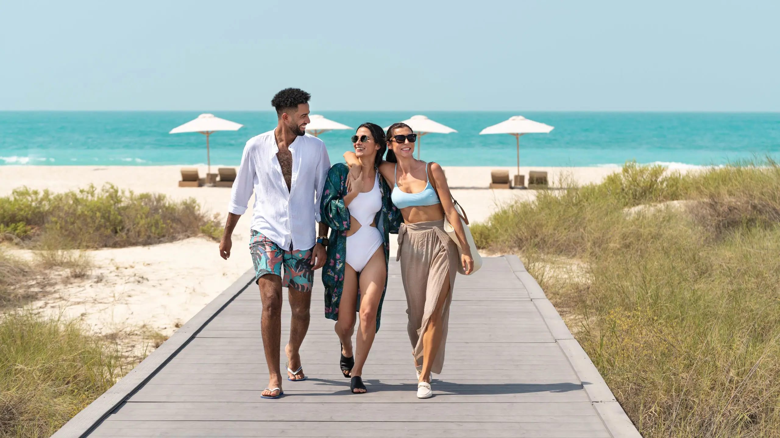 Scenic beach access at Secrets Mirabel Cancun Resort & Spa with boardwalk, white sand, and oceanfront lounge areas—ideal for MICE incentive programs, wellness breaks, and team-building retreats in Mexico.