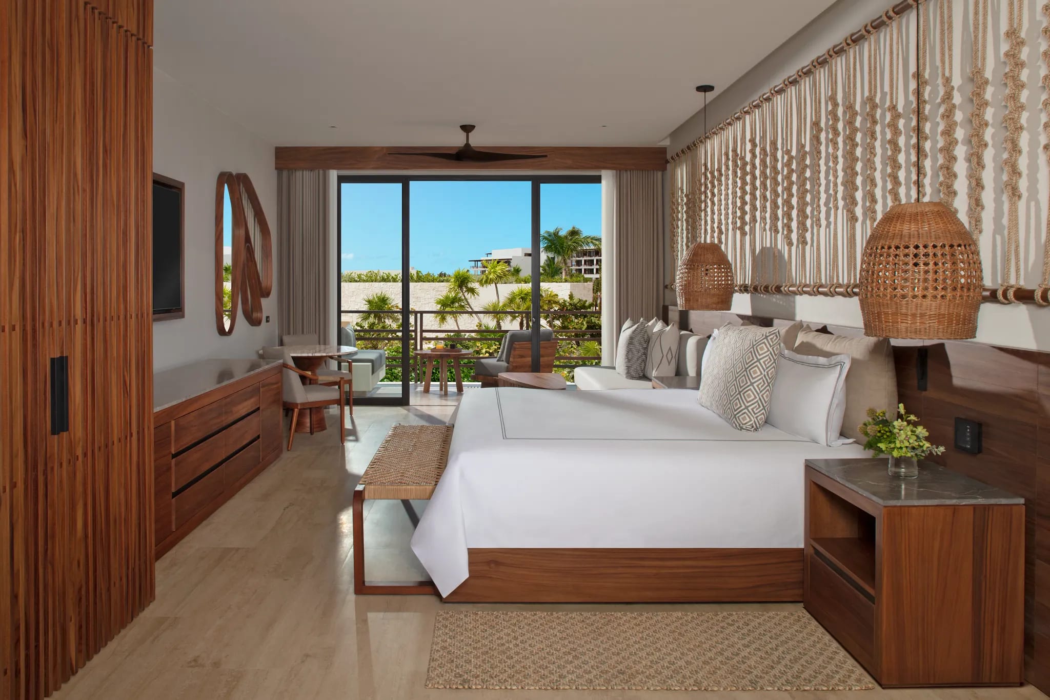 Tropical-style suite at Secrets Playa Blanca Costa Mujeres featuring oceanview balcony, natural decor, and executive amenities—ideal for MICE guests attending incentive programs, corporate retreats, or high-level meetings in Mexico.