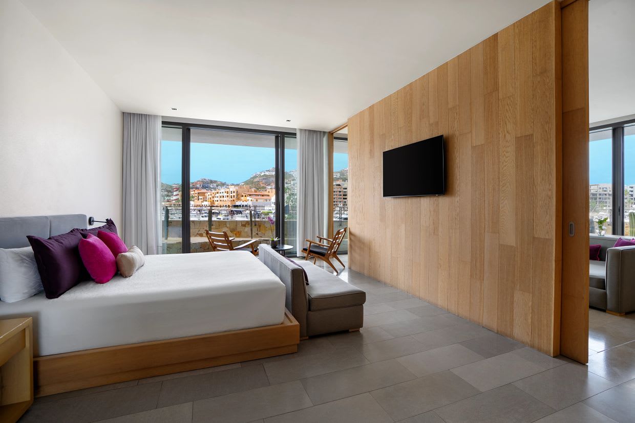 Luxury suite at Breathless Cabo San Lucas Resort and Spa with marina view, ideal for MICE planners seeking upscale accommodations for incentive travel and executive retreats.
