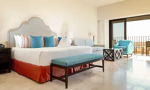 Spacious suite at Diamante Tafer Resort Cabo San Lucas featuring elegant furnishings and balcony access—ideal for MICE executive stays, incentive travel, and VIP accommodations.