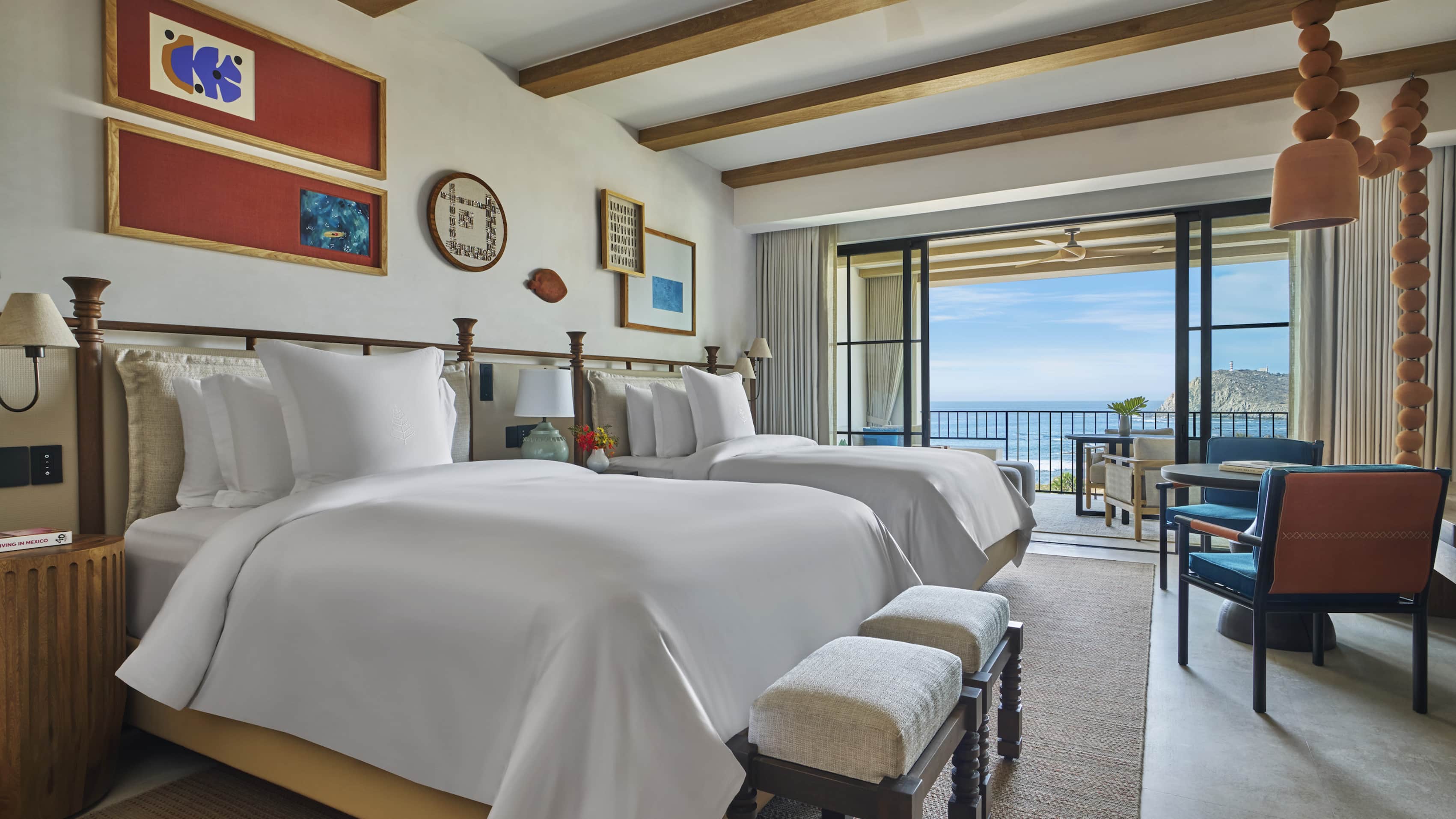 Double-bed suite at Four Seasons Resort and Residences Cabo San Lucas at Cabo Del Sol featuring ocean views, rustic-modern decor, and natural lighting—ideal for MICE group accommodations, incentive travel, and shared executive stays.