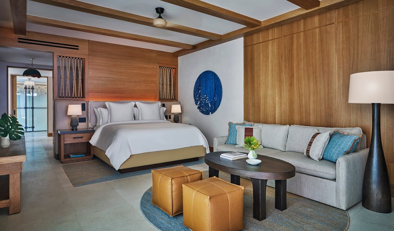 Luxury suite at Four Seasons Resort and Residences Cabo San Lucas at Cabo Del Sol featuring wood accents, modern furnishings, and spacious layout—ideal for MICE executive stays, incentive travel, and VIP accommodations.