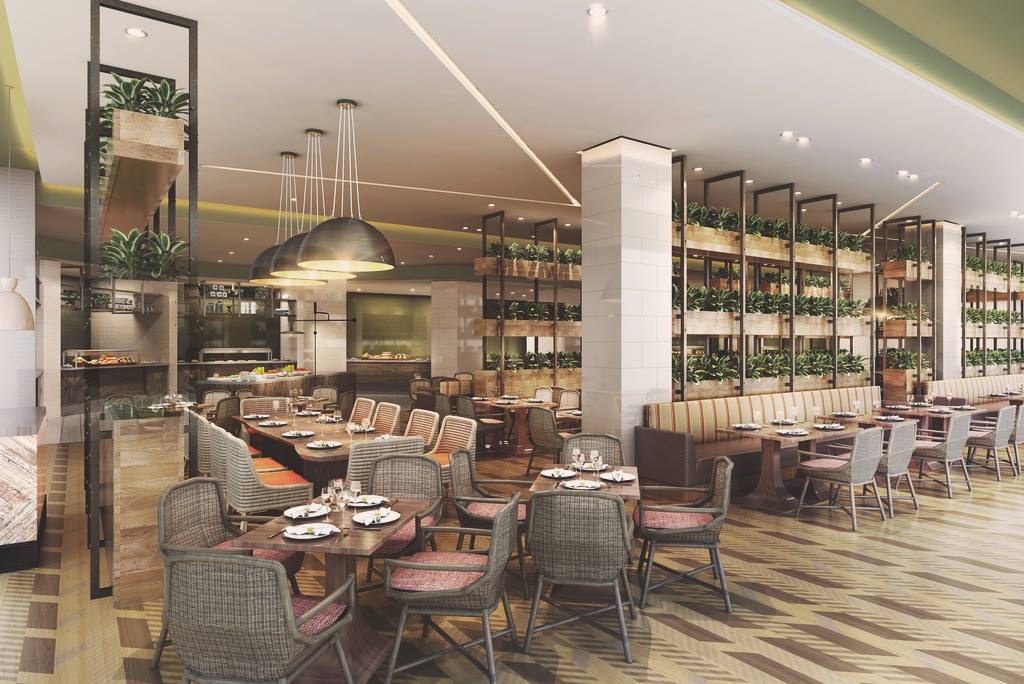 Upscale restaurant interior at Hard Rock Hotel Los Cabos featuring wood textures, lush greenery, and ambient lighting—ideal for MICE group dining, executive luncheons, and incentive program meals in Baja California Sur.
