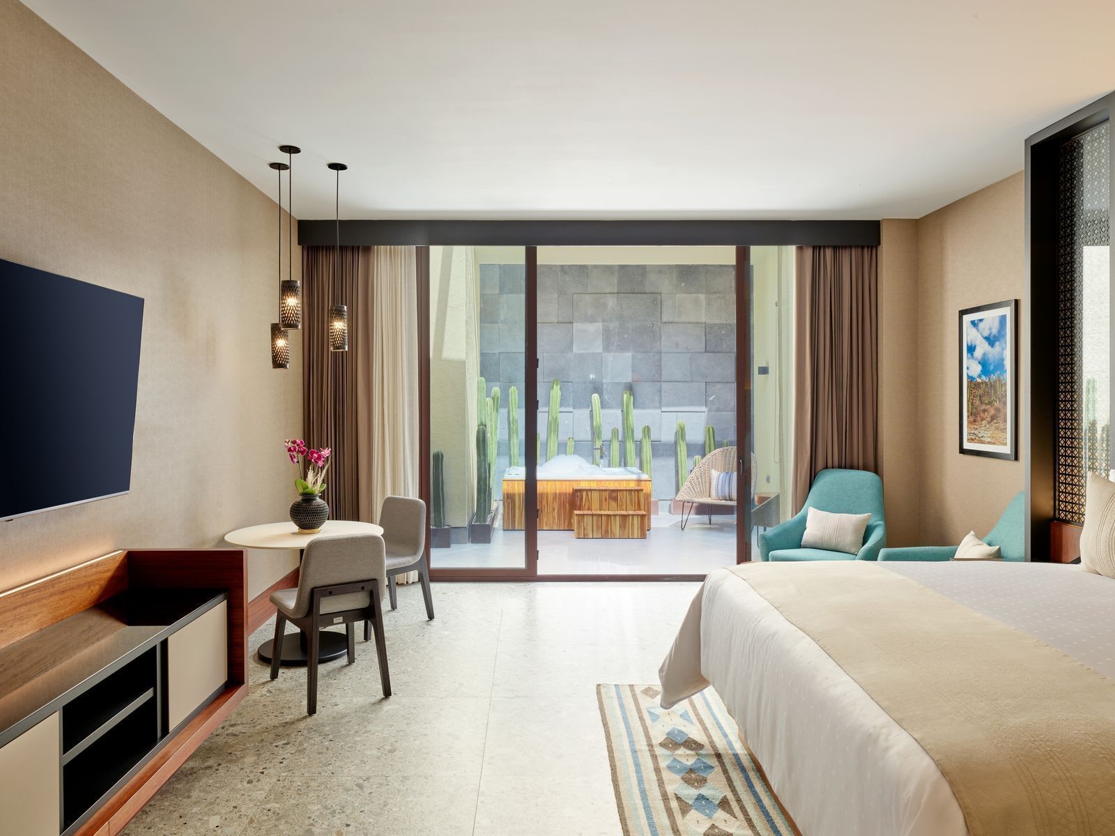 Elegant hotel suite in Oaxaca with garden patio, ideal for MICE travelers seeking upscale accommodations during meetings and incentive programs in Mexico.