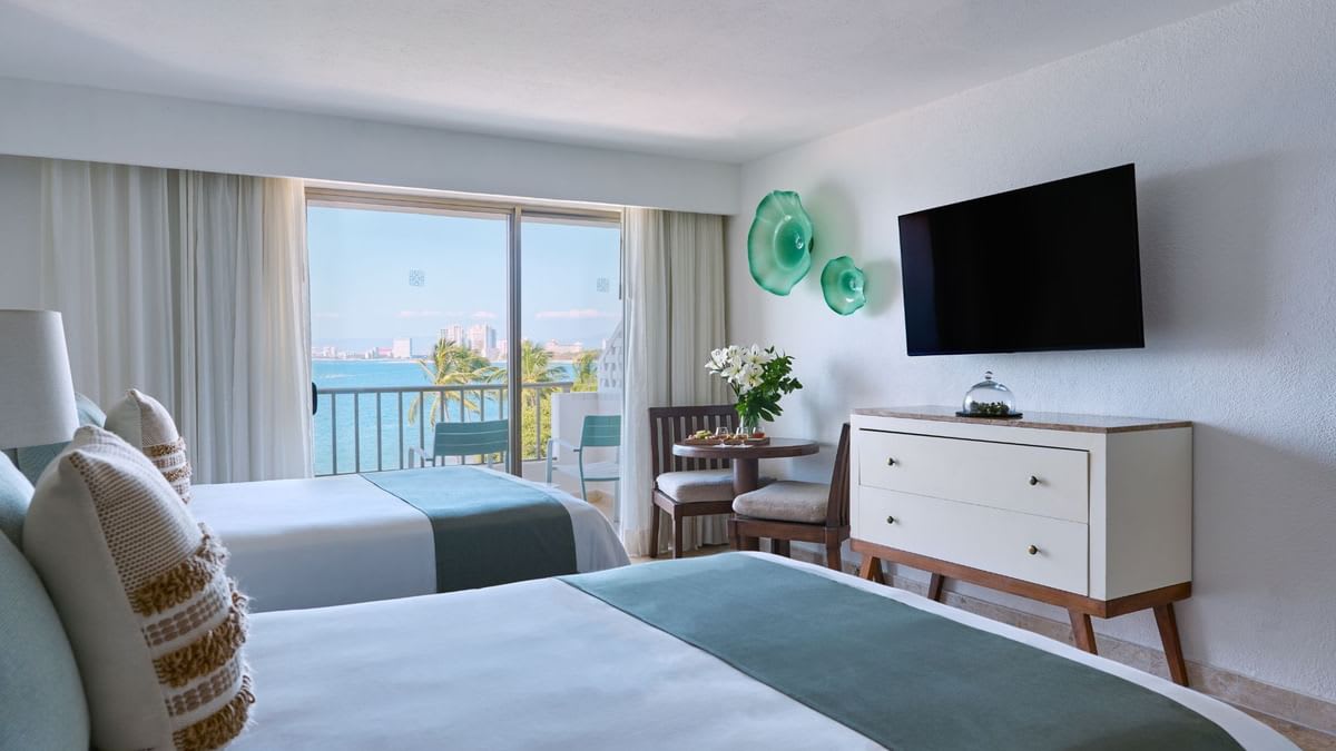 Double suite at Villa Premiere Boutique Hotel & Romantic Getaway in Puerto Vallarta, featuring oceanview balcony, modern furnishings, and serene ambiance—ideal for incentive travel, executive stays, and boutique MICE accommodations in Mexico.