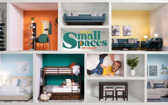 Compact living space display with stacked cushions, orange accent wall workspace, teal sofa, yellow lounge area, light blue bedroom, wooden bunk beds with stuffed animals, dark wood dining set, and decorative plants. Central text reads: "BOB'S Small Spaces BIG VALUES."