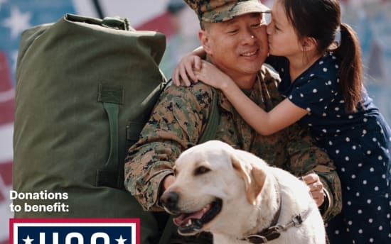 Military personnel in camouflage uniform embracing a child in a navy blue dress with white polka dots, accompanied by a yellow Labrador dog. Text reads: "For The People Who Serve.™ Donations to benefit: USO. BOB'S Discount Furniture." The image promotes donations supporting the USO through Bob's Discount Furniture.