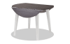 Gray and white round drop leaf dining table.