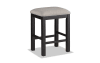 Beige and espresso backless counter height stool.