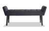 Dark gray upholstered tufted bench.