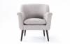 Light gray upholstered accent chair.
