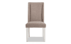 White and beige solid back upholstered dining chair.