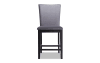 Gray solid back upholstered counter height stool.