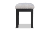Gray upholstered vanity stool.