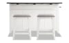 White kitchen island with brown top and 2 beige upholstered stools perfect for a small dining space.