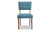 Teal panel back upholstered dining chair.