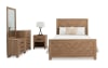 Brown bedroom set with full size bed, chesser, mirror, and nightstand.