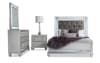 Gray bedroom set with illuminated panel bed, dresser, illuminated mirror, and nightstand.
