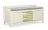 White and gray upholstered bench with storage shelves.