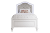 White and gray twin size upholstered bed.
