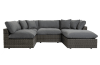 Gray wicker outdoor sectional sofa with plush gray cushions.
