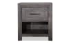 Gray nightstand with a drawer and shelf.