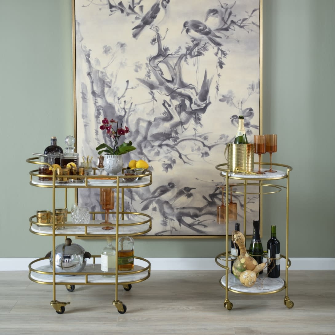 Gold and marble bar carts with everything ready to entertain.