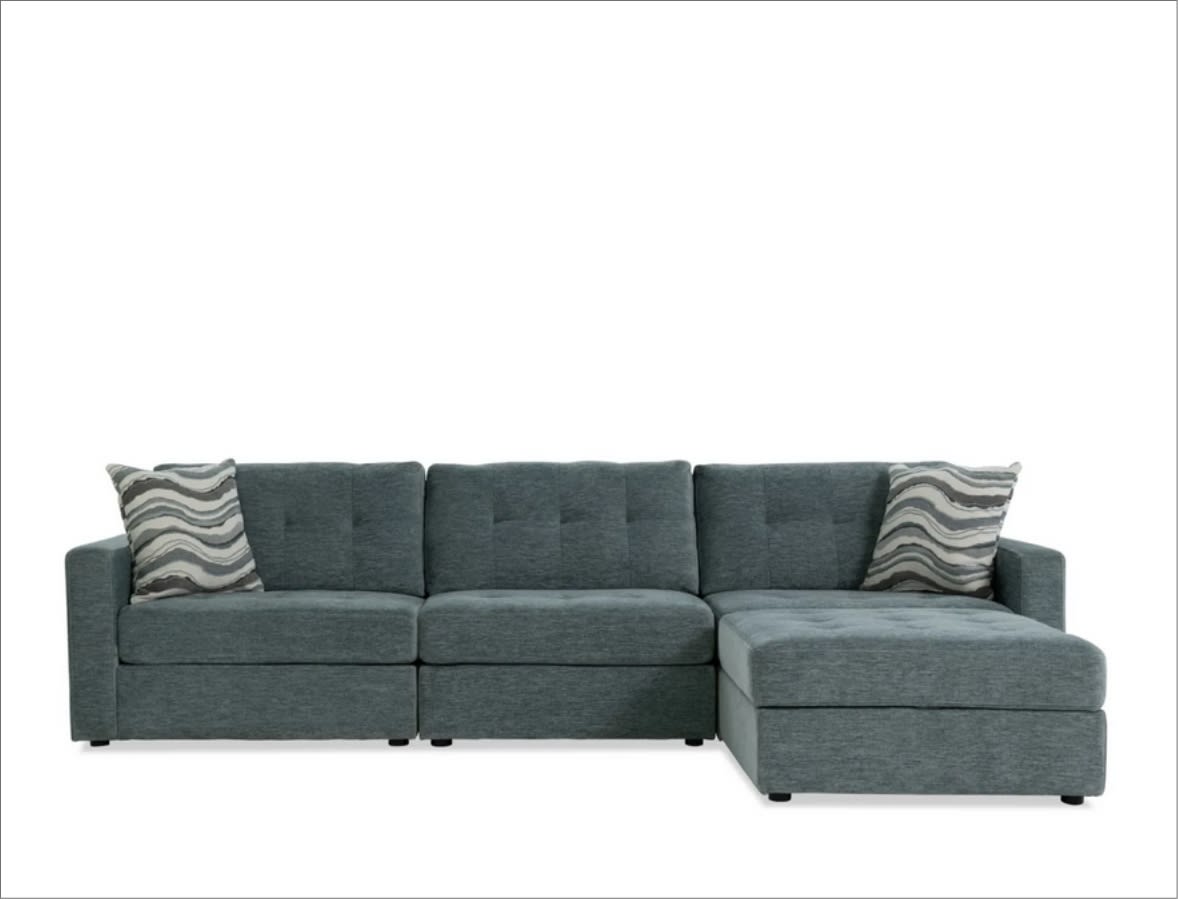 Blue 4 piece modular sofa with 2 throw pillows