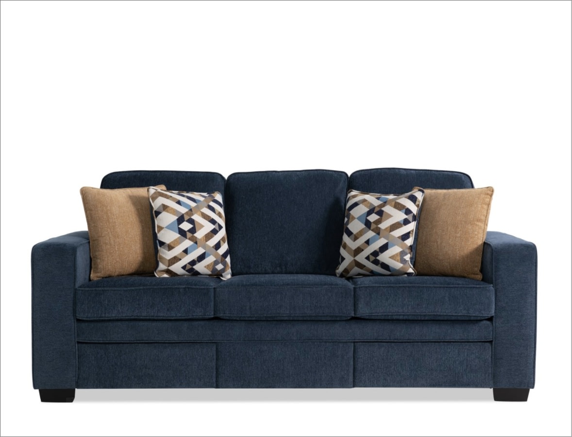 Blue sofa with beige and multi colored throw pillows