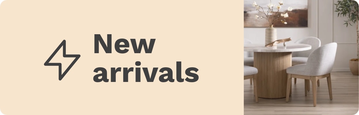 Beige background with 'New arrivals' in bold black text on the left. On the right, a modern dining set with white chairs and a round wooden table.