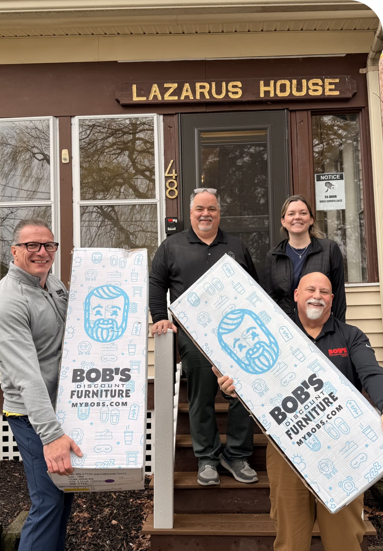 Four Bob's employees donating products to Lazarus House.