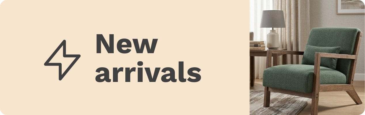 New arrivals banner with bold text and a lightning bolt icon on a beige background, alongside a modern green fabric armchair with wooden frame in a cozy living room setting.