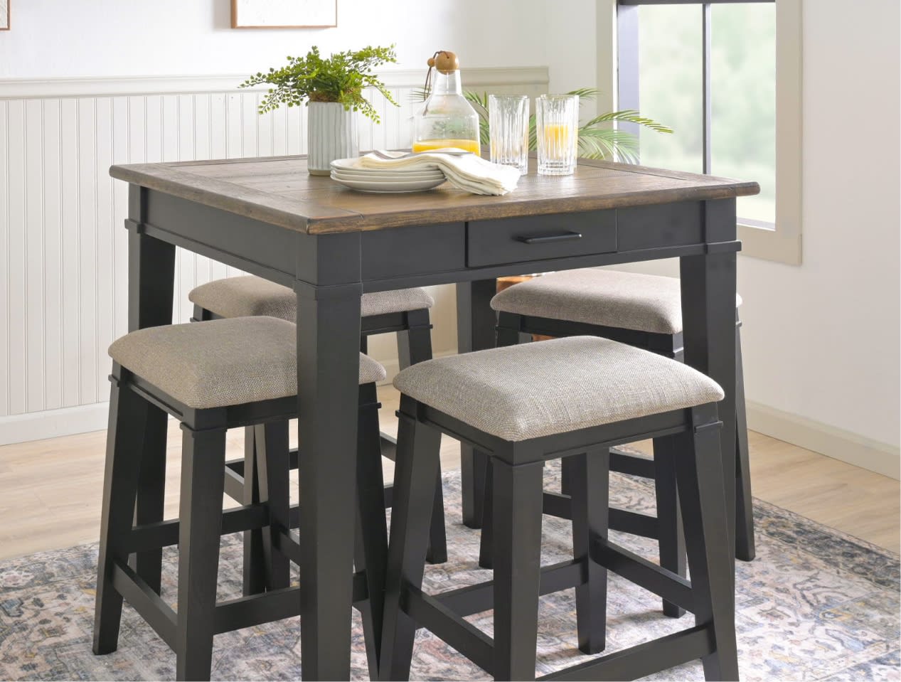 Brown & black counter height table with 4 upholstered stools