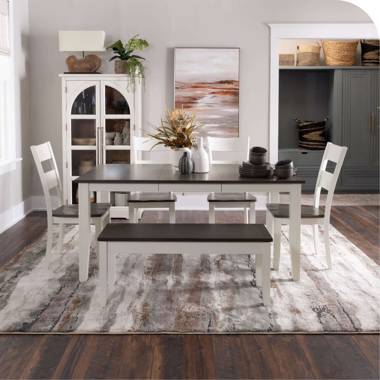 Brown and white dining room set with table, four chairs, and a dining bench.
