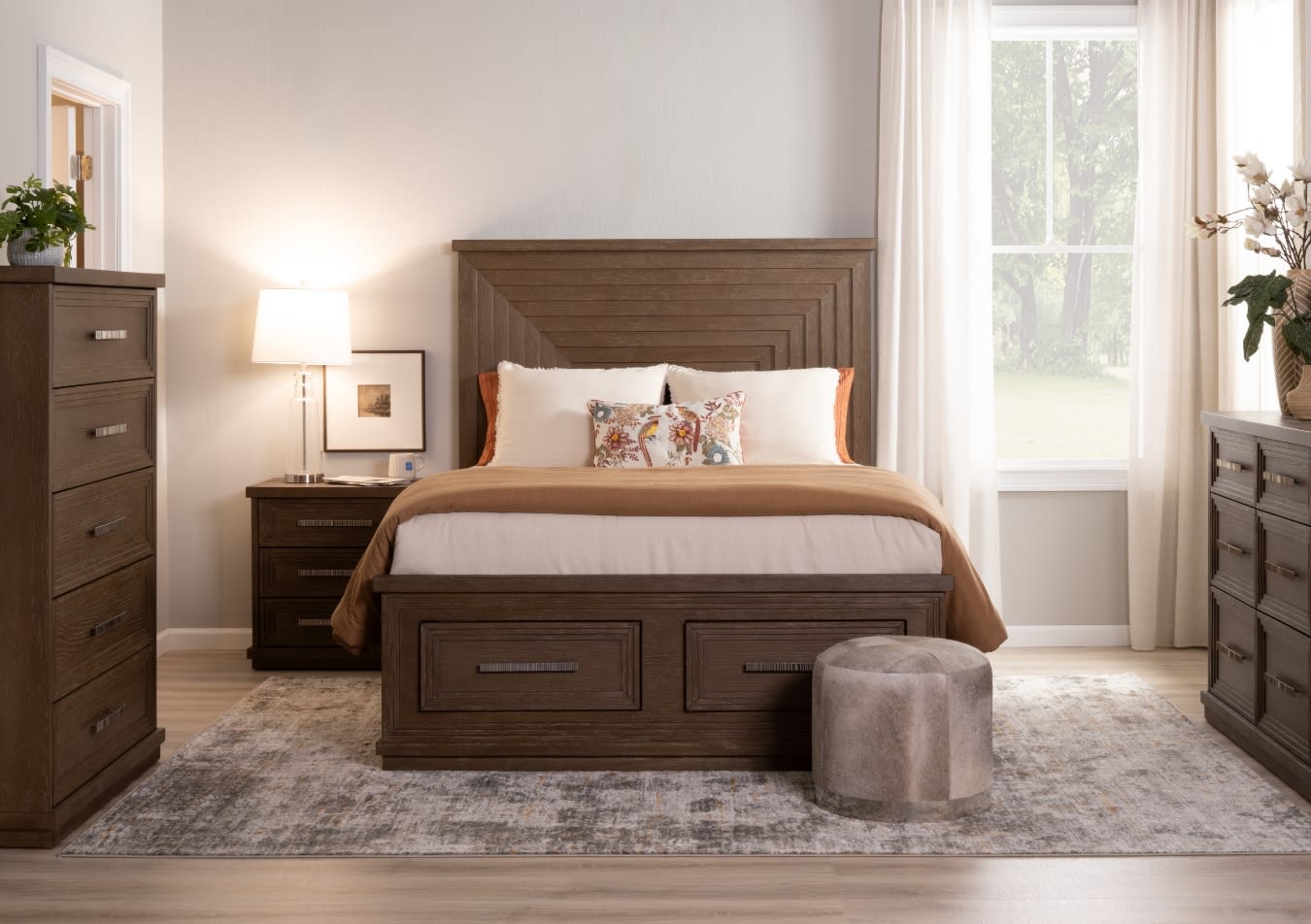 Modern bedroom set with dark wood bed frame featuring geometric headboard and storage drawers, matching nightstand, dresser, and chest.