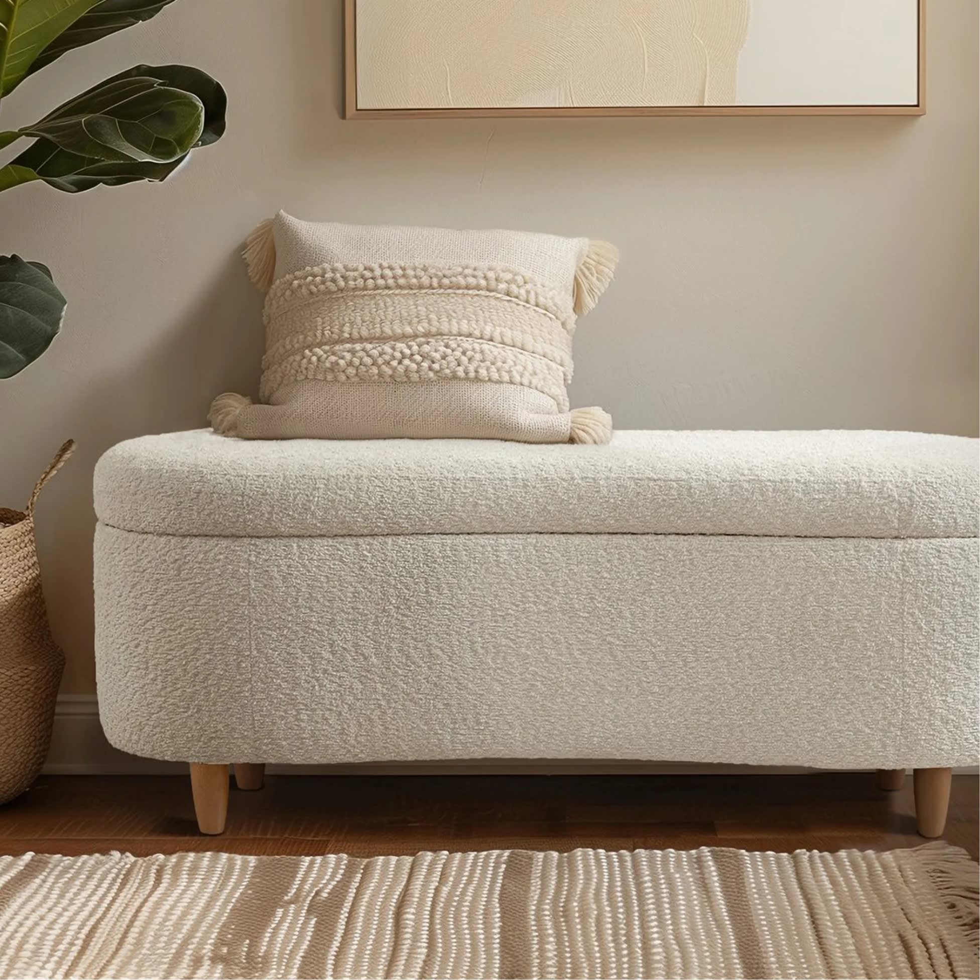Oval cream upholstered storage bench
