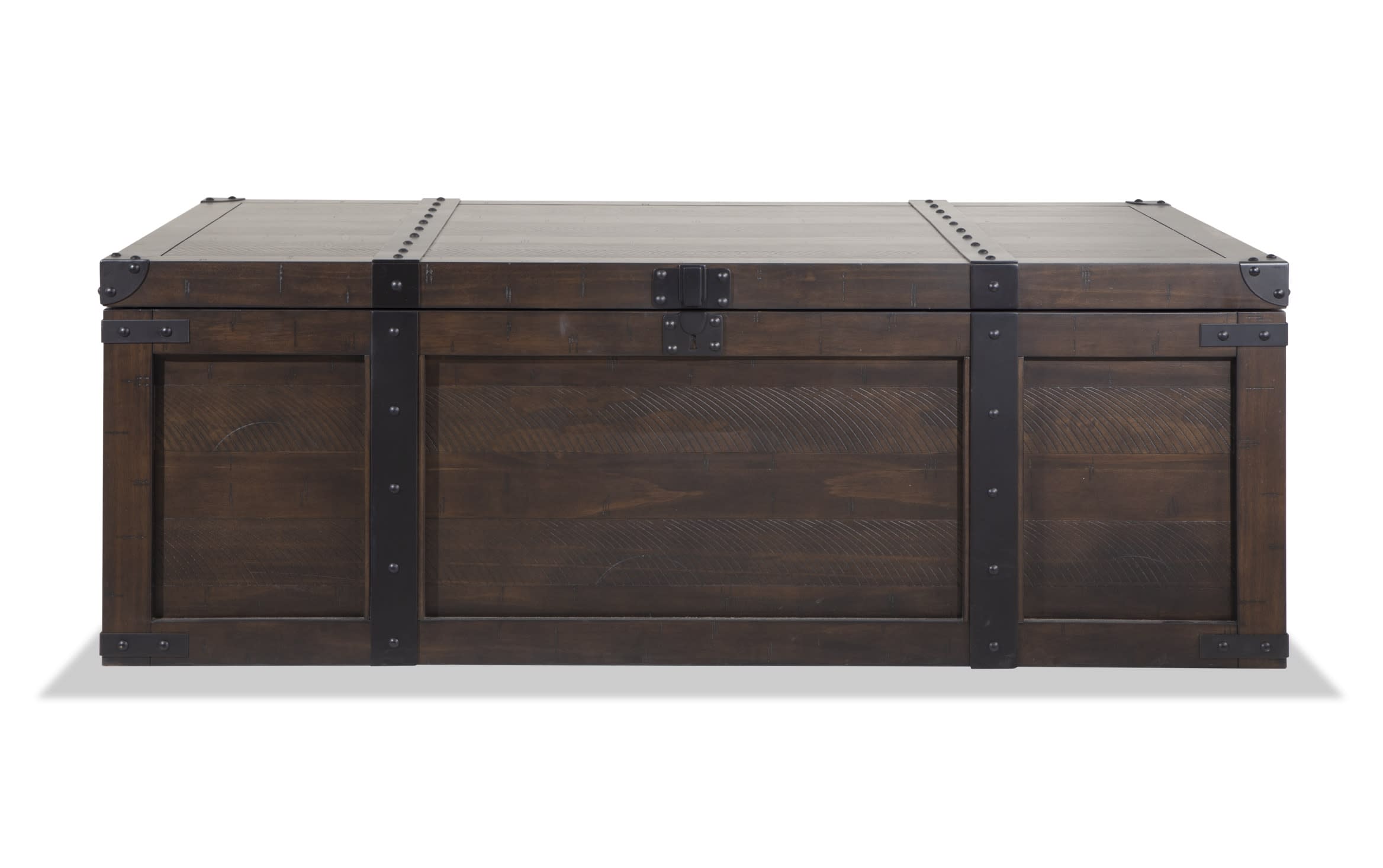 Montana Brown Storage Trunk Coffee Table from Montana Entertainment & Occasional, rustic wood with distressed brown finish, dark metal hardware, wire-brushed top, and worn corners.