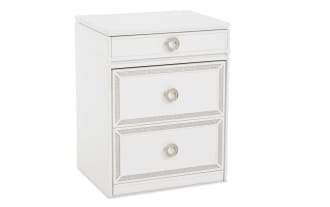 White wooden nightstand with three drawers featuring silver ring handles and decorative silver trim, modern bedroom furniture design.