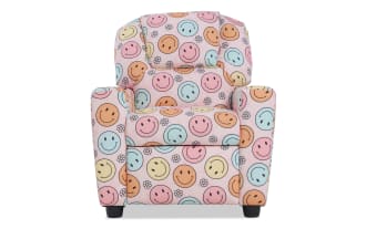 Child-sized upholstered armchair with pastel pink fabric featuring colorful smiley face and flower patterns, cushioned for comfort.